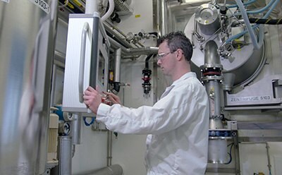 Scientist working with machinery in a lab