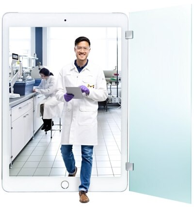 Asian man exits a lab by an iPad screen