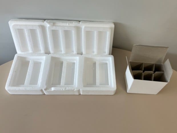 On the left, a box with EPS dividers appears. On the right, a box appears with cardboard dividers. 