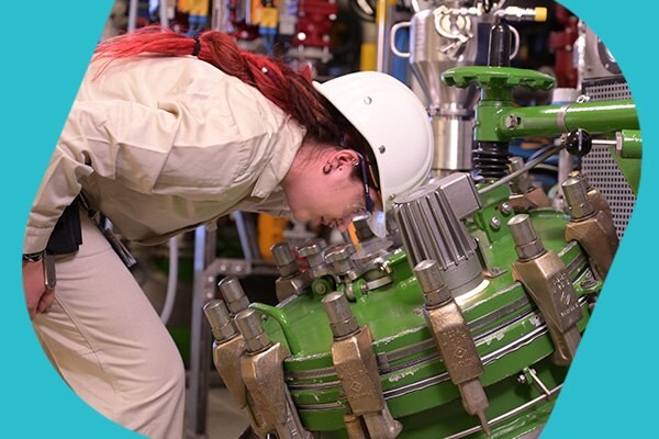 Operator checks reactor for large scale API production.